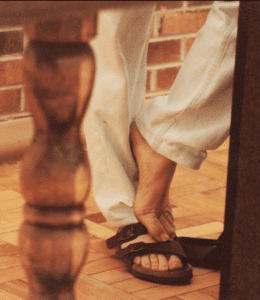 An image of Fr. Richard Rohr's sandaled feet standing.
