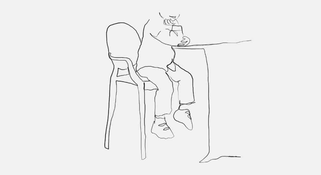 An illustration of a boy sitting at a high-top table in a tall chair with his legs hanging.
