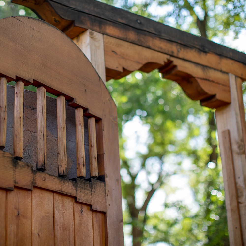 Image of wooden gate entrance to CAC.