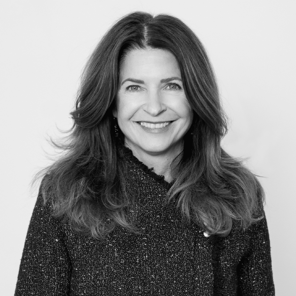 Black and white photograph of Theresa Martella, smiling, facing camera.  