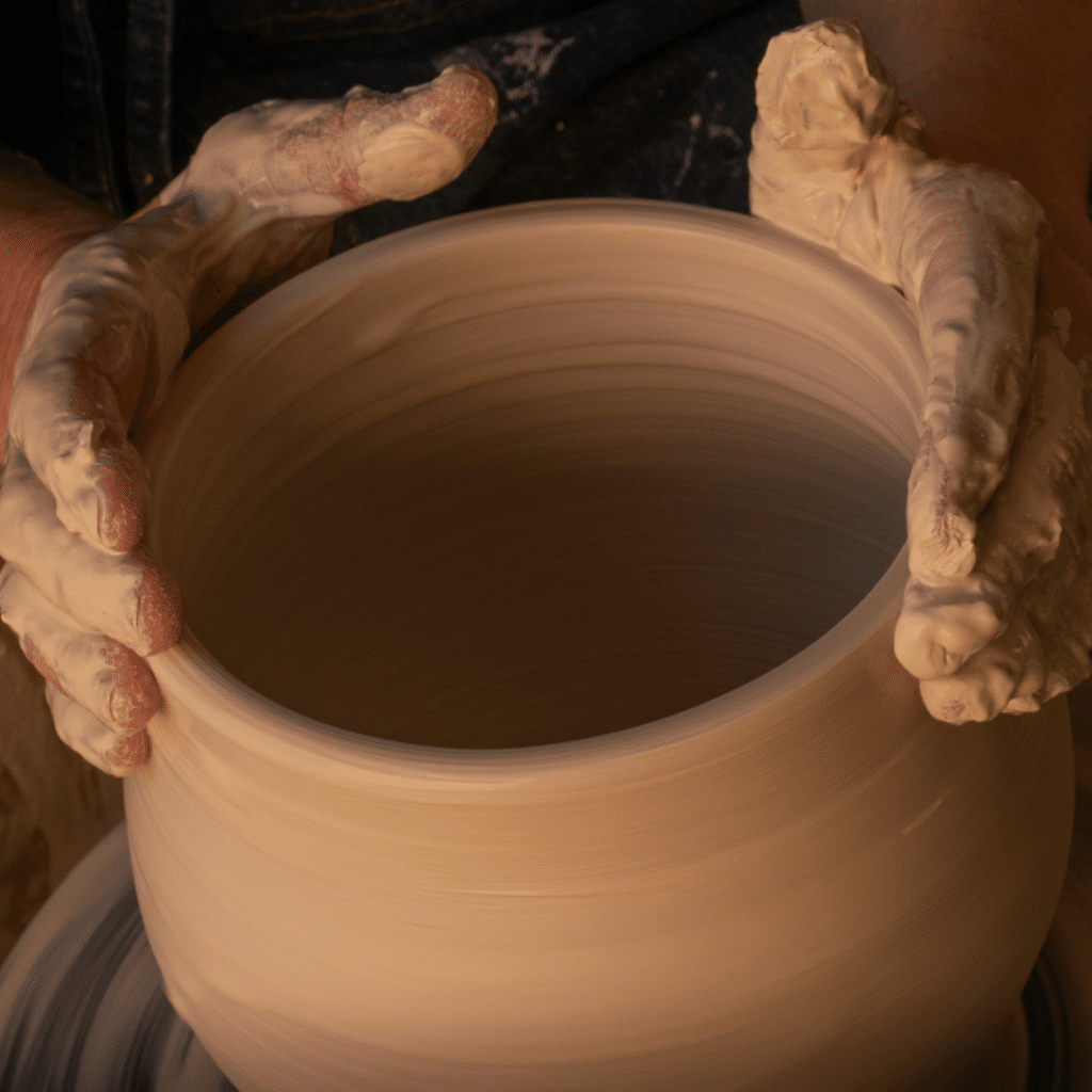 A photo of a potter's hands, that invites reflection on the 2025 Daily Meditations theme of Being Salt and Light.