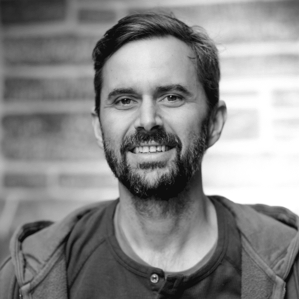 Black and white photo of Adam Barnes